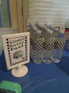 there are many bottled water bottles on the table