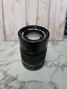 a close up of a camera lens on a table