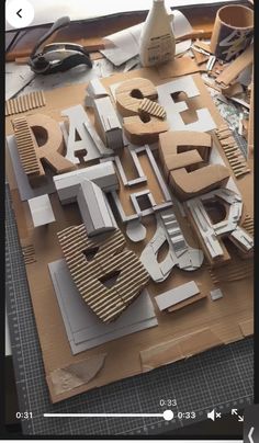 the letters are made out of cardboard and paper