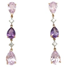 Check out these stunning French drop earrings from our collection by Mesure et Art du Temps, showcasing diamonds, amethysts and kunzites. Each earring is adorned with 4 brilliant cut F/G diamonds with a total weight of 0.21 carat. These premium quality diamonds add remarkable brilliance and sparkle to earrings. The diamonds are accompanied by 4 amethysts and 2 kunzites, adding touches of color and sophistication to the set. Amethysts feature a deep purple hue, while kunzites bring a subtle shade French Earrings, French Jewelry, Diamond Dangle Earrings, Purple Earrings, Amethyst Jewelry, Quality Diamonds, Chandelier Earrings, Teardrop Earrings, Deep Purple