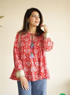 Indian ethnic print handblock print cotton Kurti in this beautiful color combination of red and white pairs beautifully well when worn with solid color pants / denims. Can be styled as it is or worn over a tank top/T-shirt for a stylish layered look.the stylish tie up detail makes for an elegant touch   This cotton kurta is handmade by the artisans of Rajasthan,India in the heart of Pink City Jaipur,known for its block prints and soothing cottons. Model is wearing size M Size chart in pictures. Cotton Ikat Print Long Sleeve Top, Long Sleeve Cotton Top With Ikat Print, Bollywood Style Long Sleeve Kurta With Block Print, Bollywood Style Long Sleeve Block Print Kurta, Festive Long Sleeve Block Print Kurta, Red Block Print Straight Kurta, Red Straight Kurta With Block Print, Bollywood Style Red Long Sleeve Tops, Festive Straight Kurta Block Print Blouse