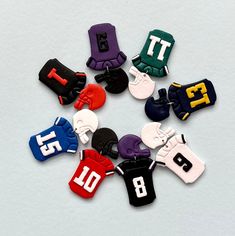 a group of small sports themed items on a white surface with the number ten in them