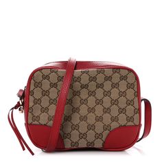 This is the authentic GUCCI Monogram Mini Bree Messenger Bag in Red. This chic cross body bag is crafted of the iconic brown and beige monogram canvas with red leather trim. The bag features a leather shoulder strap and gold hardware. The crossbody opens to a beige fabric interior with a patch pocket and red leather card slots. Red Monogram Canvas Shoulder Bag For Travel, Gucci Shoulder Bag In Monogram Canvas With Gold-tone Hardware, Gucci Monogram Canvas Shoulder Bag With Gold-tone Hardware, Gucci Signature Coated Canvas Travel Shoulder Bag, Gucci Bag With Gold-tone Hardware In Signature Coated Canvas, Gucci Monogram Canvas Shoulder Bag With Leather Trim, Gucci Shoulder Bag With Leather Trim And Monogram Canvas, Red Monogram Canvas Shoulder Bag, Classic Red Monogram Canvas Bag