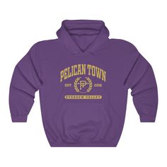 A college style hoodie sweatshirt representing Stardew Valley's Pelican Town All sweatshirts are printed to order and take 2-7 business days for fulfillment. More about the sweatshirt: This soft sweatshirt has a loose fit for a comfortable feel. With durable print, it will be a walking billboard for years to come. .: 50% Cotton 50% Polyester .: Medium-heavy fabric (8.0 oz/yd² (271.25 g/m .: Loose fit .: Sewn in label .: Runs true to size Casual Pre-shrunk Hoodie For College, Varsity Style Pre-shrunk Hoodie For Streetwear, Varsity Pre-shrunk Hoodie For Streetwear, Collegiate Hooded Hoodie For Campus, Varsity Hooded Hoodie For Campus, Varsity Hoodie For Campus, Hooded Pre-shrunk Sweatshirt For College, College Hoodie Sweatshirt With School Spirit, Varsity Hoodie Sweatshirt For Campus