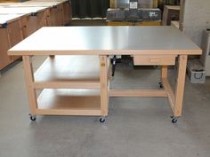 a workbench in a garage with lots of cabinets