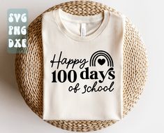 a t - shirt with the words happy 100 days of school on it next to a wicker basket