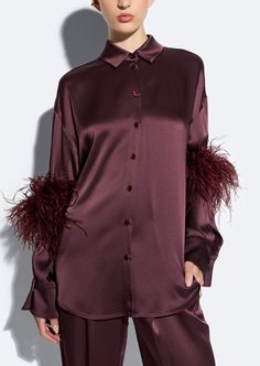 Featured In The Fall 2024 Collection This doubleface satin button up shirt with front placket pockets and dolman sleeves with feathers at elbows. Materials: 61% Acetate, 39% Viscose Trim: 100% Real Ostrich Feathers Care: Professional Care Only Fit: Oversized fit. True to Size Model is 5'10" and Wearing a S Satin Button Up, Dress Satin, Ostrich Feathers, Runway Collection, Fall 2024, 2024 Collection, In The Fall, Event Dresses, Dolman Sleeve