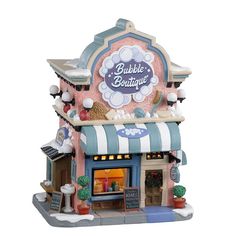 a small toy store with lots of decorations on the front and side of it's building