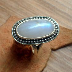 "\"Giglirigli Gems\" Welcomes you \"Rare Moonstone Ring, Gemstone Ring, White Band Ring, 925 Sterling Silver Jewelry, Wedding Anniversary Gift, Ring For Mother\" Gemstone : Moonstone Metal : 925 Sterling Silver Moonstone Pendants https://www.etsy.com/shop/Giglirigligems?ref=seller-platform-mcnav&search_query=Moonstone+pendants Moonstone Earrings https://www.etsy.com/shop/Giglirigligems?ref=seller-platform-mcnav&search_query=Moonstone+earrings Moonstone Ring https://www.etsy.com/shop/Giglirigligems?ref=seller-platform-mcnav&search_query=Moonstone+ring A complete hub of Silver/Gold Jewelry & Gemstone Manufacturing Our Ability - 1000 Pieces per week &CAD/CAM Designing,Wire Wrapped Jewelry ,Rhodium Plating ,Micron plating,Grain Setting etc We are any Design as per your Requirement Payment poli Luxury Sterling Silver Moonstone Ring With Gemstone Accents, Luxury Sterling Silver Moonstone Ring For Formal Occasions, Luxury White Moonstone Crystal Ring, Luxury Hallmarked White Moonstone Ring, Luxury White Cabochon Moonstone Ring, Luxury Untreated Moonstone Ring For Anniversary, Silver Jewelry Wedding, Silver Gold Jewelry, Cad Cam