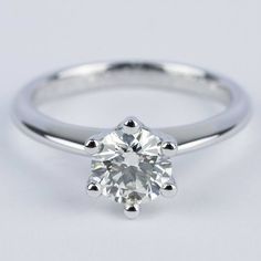 a white gold engagement ring with a round cut diamond