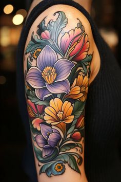 a woman's arm with colorful flowers on it