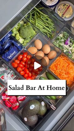 an open refrigerator filled with lots of vegetables and eggs in it's trays