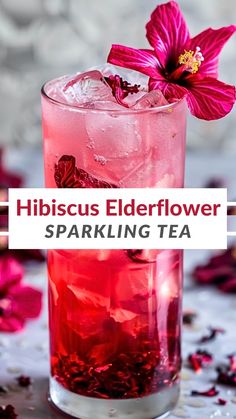 hibiscus elderflower sparkling tea in a tall glass with a flower on top