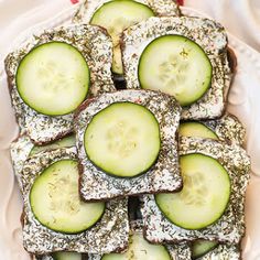 cucumber sandwiches with sprinkles in a white dish