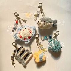 crocheted keychains with animals and fish on them