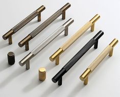 several different types of handles and knobs on a white surface