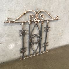 an old iron gate on the side of a building