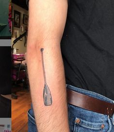 a man with a tattoo on his arm and an image of a spoon in the other