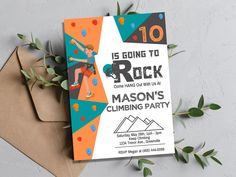 this is an image of a rock climbing birthday party card with envelopes and greenery