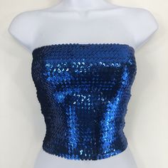 This Royal Blue Sequin Strapless Tube Top is made with high quality sequins on the outside, as well as polyester on the inside. The size of the tube top is 12 inches wide and 10 inches tall when flat. It is also stretchy and form fitting as well. If you have any questions about our products or have any inquiries please contact us and I will be glad to help. *Since this item is hand-made, the design can vary slightly from the image. Cheap Purple Strapless Tube Top, Strapless Sequined Fitted Tube Top, Fitted Sequin Strapless Tube Top, Strapless Sequin Tops For Party Season, Sequin Fitted Tube Top For Club, Blue Fitted Sequin Fabric For Night Out, Blue Sequin Fabric For Summer Night Out, Fitted Blue Sequin Fabric For Night Out, Sequin Bandeau Top For Party