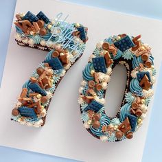 a cake shaped like the number 50 is decorated with chocolate and blue icing,