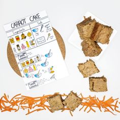 carrot cake cut into pieces on a plate next to an orange shredded carrots and paper