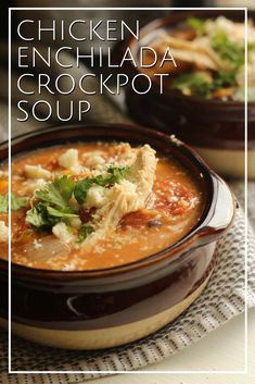 chicken enchilada crockpot soup in a brown bowl on a table