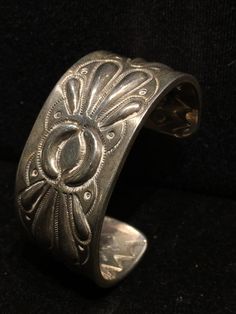 "Vintage 1970's Native American Indian made heavy gauge repousse & stamp work sterling silver cuff with geometric tribal motifs / design. Interior also fully stamped! -109 grams -1 1/16\" wide -5\" interior circumference plus 1 5/16\" gap with a little flexibility -unsigned, unknown maker 489R - This stunning piece is coming from an exciting relationship with a well known & popular Santa Fe, NM, jewelry gallery. I will be listing many exquisite pieces, some at lower prices than they are Vintage Ceremonial Stamped Cuff Bracelet, Vintage Stamped Sterling Silver Cuff Bracelet, Vintage Sterling Silver Stamped Cuff Bracelet, Vintage Silver Etched Cuff Bracelet, Ornate Stamped Bracelet Jewelry, Vintage Antique Silver Stamped Cuff Bracelet, Vintage Sterling Silver Cuff Bracelet For Ceremonial Occasions, Vintage Sterling Silver Stamped Bangle, Antique Stamped Sterling Silver Cuff Bracelet