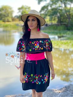 This Beautiful Off the Shoulder Mexican Dress is a traditional hand embroidered dress. It's lightweight with elastic around the Shoulder and waist, made out of cotton and is full of vibrant florals. Please note: The belt modeled comes with the dress and is included in the price. The Jewelry modeled may be purchased in a variety of colors found in a separate post. Mexican Theme Party Outfit Women, 5 De Mayo Outfit Ideas, Heritage Outfits, Mexican Theme Party Outfit, Mexican Theme Dresses, Mexican Traditional Dress, Outfit Mexicano, Mexico Dress, Hand Embroidered Dress