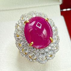 What you see in the pictures, is what you will get! No duplicates or twins! One of a kind EXTREMELY GORGEOUS AND RARE CERTIFIED NO-GLASS-FILLING, GENTLE HEAT ONLY, VIVID RED, BURMESE RUBY RING. This ruby is so rare! At 18.46 carats! Extremely huge! With stunning vivid red color and excellent depth and translucent quality, VS clarity. Rare BURMESE, signature RED Color, EXTREMELY BEAUTIFUL! With SUBSTANTIAL halo of brilliant round, F/VS diamonds. Set in a LUXURIOUS DESIGNED, 18K solid yellow gold Luxury Yellow Gold Ruby Ring With Vs Clarity, Luxury Round Cabochon Ruby Ring, Luxury Cabochon Ruby Ring For Wedding, Luxury Octagon Ruby Ring For Wedding, Luxury Red Oval Cabochon Ruby Ring, Luxury Yellow Gold Ruby Ring With Halo Setting, Luxury Red Round Cut Halo Ring, Huge Engagement Rings Luxury, Engagement Rings Luxury