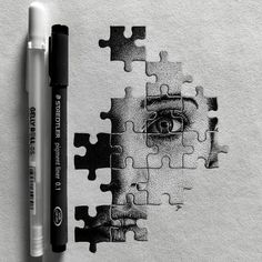 a drawing of a person's face with puzzle pieces surrounding it and a marker