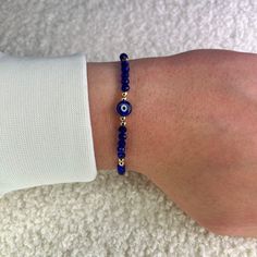 Protect yourself from negativity with our blue evil eye bead bracelet with gold balls and bring only positive vibes into your life. Since all of our Nazar protective bracelets with the popular Turkish eye are adjustable in size, they fit children, women and men and are therefore the perfect gift. What are the advantages of our 100% handmade blue protective amulet? ❤️ Unique Hamsa or Boncuk design. ❤️ Uniquely braided and therefore suitable for every wrist. ❤️ Many color variations and therefore Gold Evil Eye Bracelet With Letter And Round Beads, Blue Spiritual Bracelets With Letter Beads, Spiritual Blue Bracelets With Letter Beads, Blue Beaded Bracelets With Evil Eye, Gold Hand-strung Evil Eye Bracelet For Friendship, Blue Spiritual Healing Friendship Bracelets, Adjustable Blue Evil Eye Bracelet With Round Beads, Blue Evil Eye Round Beaded Bracelets, Blue Evil Eye Bracelet With Round Beads