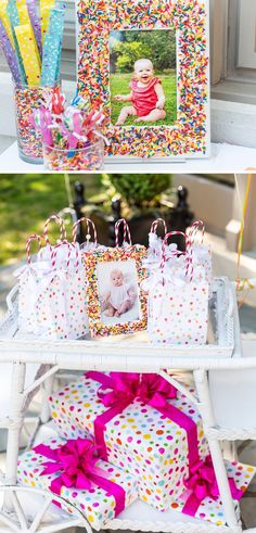 a table topped with lots of candy and candies next to a small photo frame