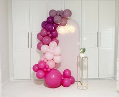 a room decorated with balloons and lights