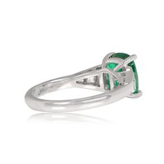 This stunning gemstone ring features a green cushion cut natural emerald, GIA-certified as 2.48 carats with great saturation. The emerald is prong-set in 18k white gold. Tapered baguette cut diamonds adorn the shoulders of this ring.
The total approximate diamond weight in this ring is 0.53 carats. The center emerald measures 9.36mm x 7.67mm x5.46mm.
If you have any questions about our Madison Ring, please contact us. Platinum Baguette Cut Green Emerald Ring, Green Oval Emerald Ring In Platinum, Green Platinum Emerald Ring For May Birthstone, Luxury Green Cushion Cut Emerald Ring, Silver Emerald Ring With Cushion Cut, Green Emerald Ring With Polished Finish, Luxury Silver Emerald Ring With Cushion Cut, Estate Diamond Jewelry, Green Cushions