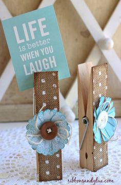 two wooden blocks with flowers on them and a sign that says life is better when you laugh