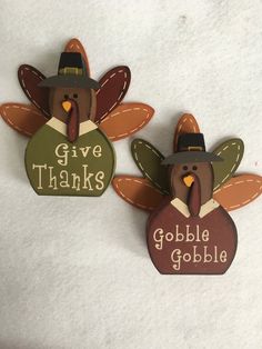 two turkeys with thanksgiving hats on their heads and the words give thanks to gobble gobble