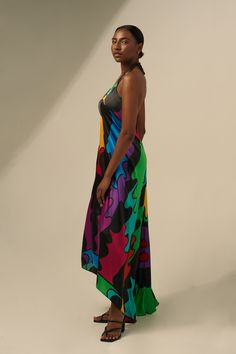 The Sharon Keyser Collection debuted on the runway at New York Fashion Week. The Collection includes this luxurious Halter Neck Backless Dress that features the artist's original New Dawn 4 design. Crafted from 100% Silk, this elegant dress moves with you and flatters the body with its romantic and sophisticated style The vibrant colors make it a show-stopper. 100% Silk Light and luxurious Flattering halter neck style Open back Stylish train Machine wash, hang dry, low heat iron, steam safe, or Summer Evening Multicolor Maxi Dress, Avant-garde Sleeveless Summer Dress, Multicolor Midi Dress For Summer Evenings, Bold Multicolor Beach Dress, Multicolor Halter Neck Maxi Dress For Evening, Sleeveless Multicolor Halter Evening Dress, Multicolor Sleeveless Halter Dress For Evening, Multicolor Midi Beachwear Dress For Party, Multicolor Spring Evening Halter Dress