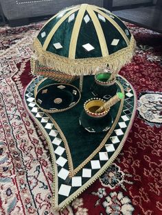 an elaborately decorated table on top of a rug