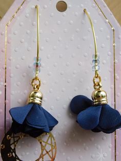 These are fun, stylish dark navy blue earrings that can be casual or dressy.  One inch floral tassel on gold finish marquis ear wire with decorative beads.  Measurement from top of ear wire to bottom of tassel is 2 ¾" Adjustable Blue Tassel Earrings For Parties, Blue Flower Earrings With Ear Wire For Party, Blue Dangle Flower Earrings For Party, Navy Blue Earrings, Tassel Earring, Decorative Beads, Fort Wayne, One Inch, Dark Navy Blue