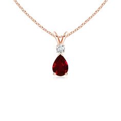 This classic solitaire pendant features a pear-shaped ruby secured in a prong setting. A brilliant round diamond sits atop the purplish red gemstone. Simple yet alluring, this ruby pendant in 14k rose gold is crafted with a lustrous v-bale. Ruby Necklace Pendant, Solitaire Pendant Necklace, July Birthstone Jewelry, Ruby Pendant, Ruby Necklace, Rose Gold Chain, Red Gemstones, Teardrop Pendant, Station Necklace