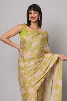 Introducing our enchanting Linda Lime Green Georgette Floral Sequins One Minute Saree – a kaleidoscope of style that's like a garden in full bloom. Imagine yourself wrapped in the vivid vibrancy of lime green georgette, adorned with delicate floral sequins that shimmer like morning dew on petals. The Ivory white cut dana tassels gracing the pallu's edges, adding a playful twist to your elegance. Completing this masterpiece is a raw silk blouse, featuring cap sleeves and a corset neckline, making Corset Neckline, Lime Green Blouse, One Minute Saree, Raw Silk Blouse, Draped Saree, Floral Print Sarees, Print Saree, Drape Saree, Morning Dew