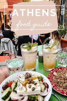 a table topped with plates of food and drinks