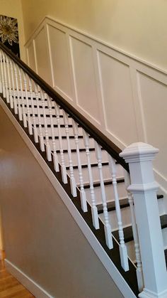 an image of a staircase with white railings