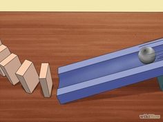 a blue object is laying on the floor next to a piece of wood that has been cut in half