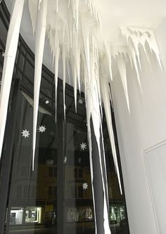 icicles hanging from the ceiling in front of a building