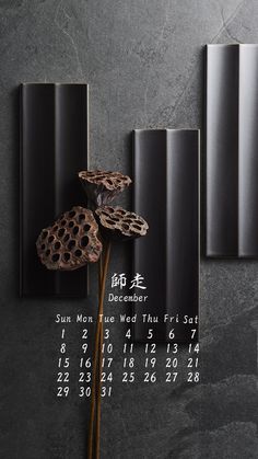 a wall mounted calendar with a flower on it's side and the date in chinese