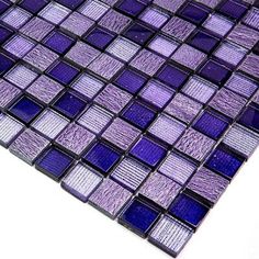 a close up view of a purple glass mosaic tile