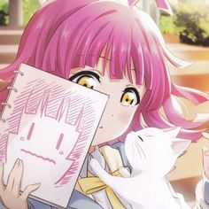 a girl with pink hair holding up a piece of paper