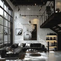 a living room filled with black furniture and lots of glass doors leading to the top floor